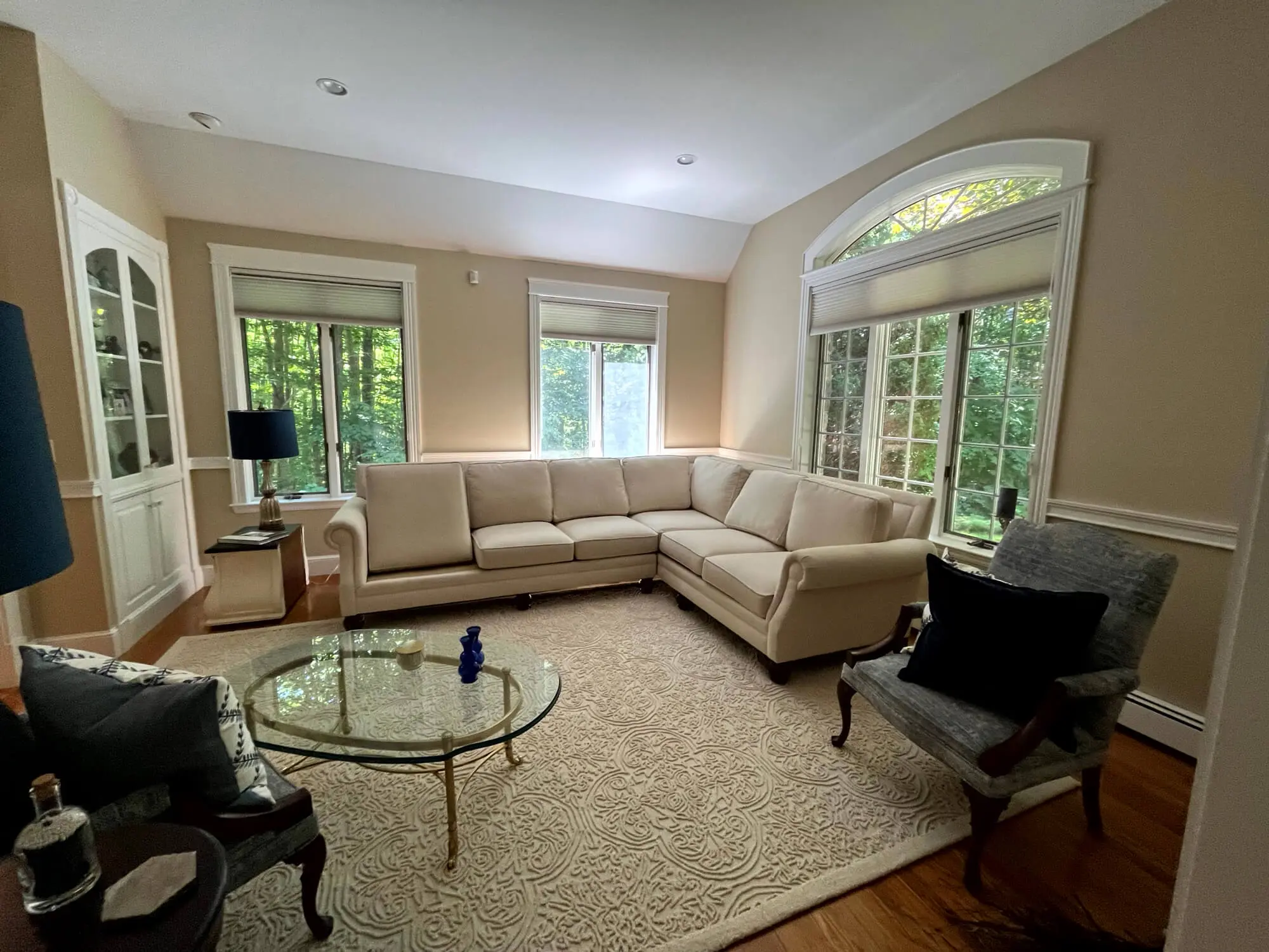 Bright, elegant living room with smooth neutral walls, crisp trim, and detailed finishes completed by Interior Painters in Portland, ME.