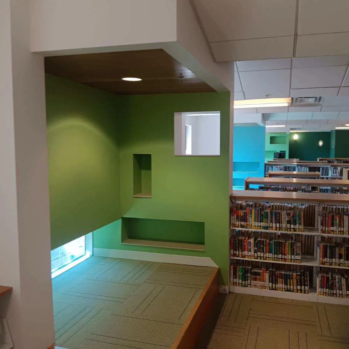 Project gallery Commercial Interior Painting highlighting a modern library interior with clean architectural details and vibrant green walls completed by Zellers Painting & Contracting.