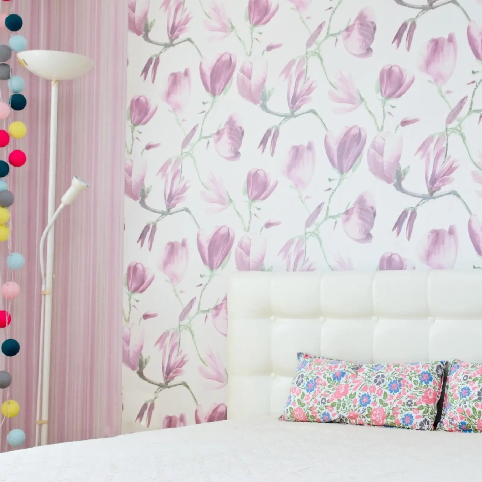 Stylish bedroom interior featuring professionally installed floral wallpaper with soft pink tones and clean seams completed by Zellers Painting & Contracting.